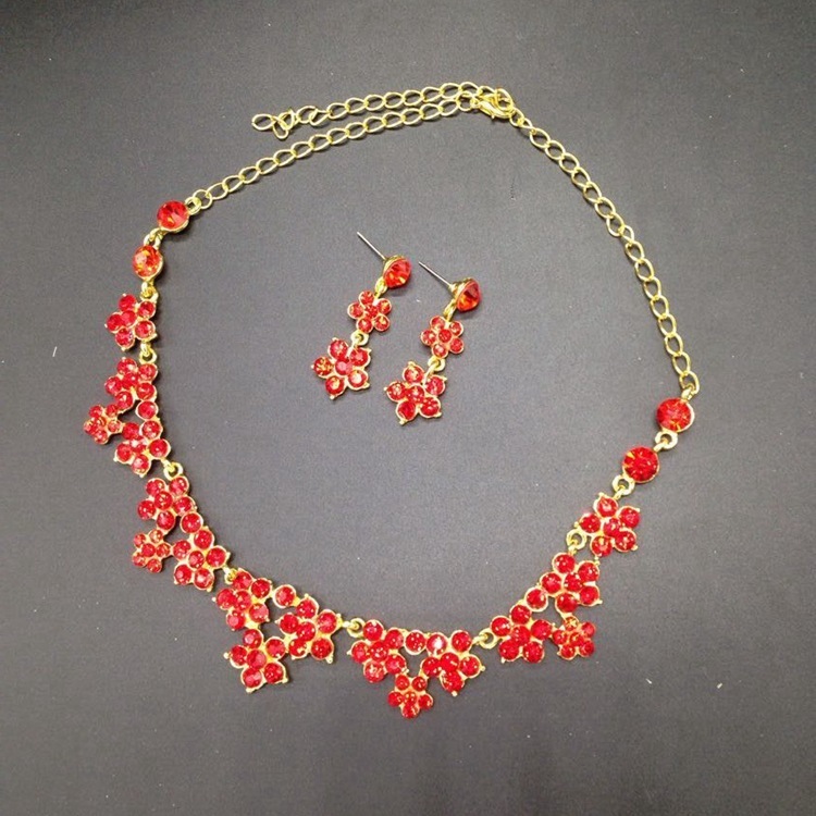 gold-tone floral crystal statement necklace with vibrant red flower-shaped gemstones for women
